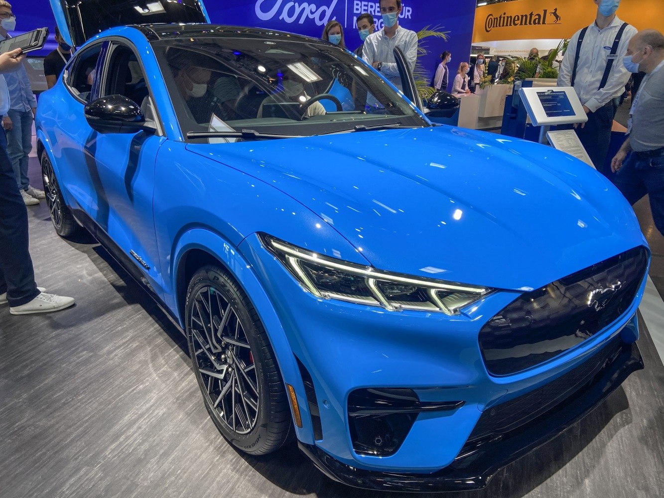 Electric SUV front view with LED headlights and sporty design in blue