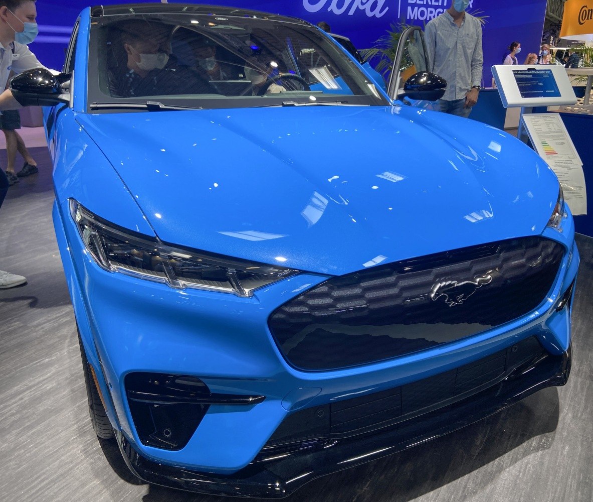 Front view featuring hexagonal grille with Mustang emblem and sharp LED headlights