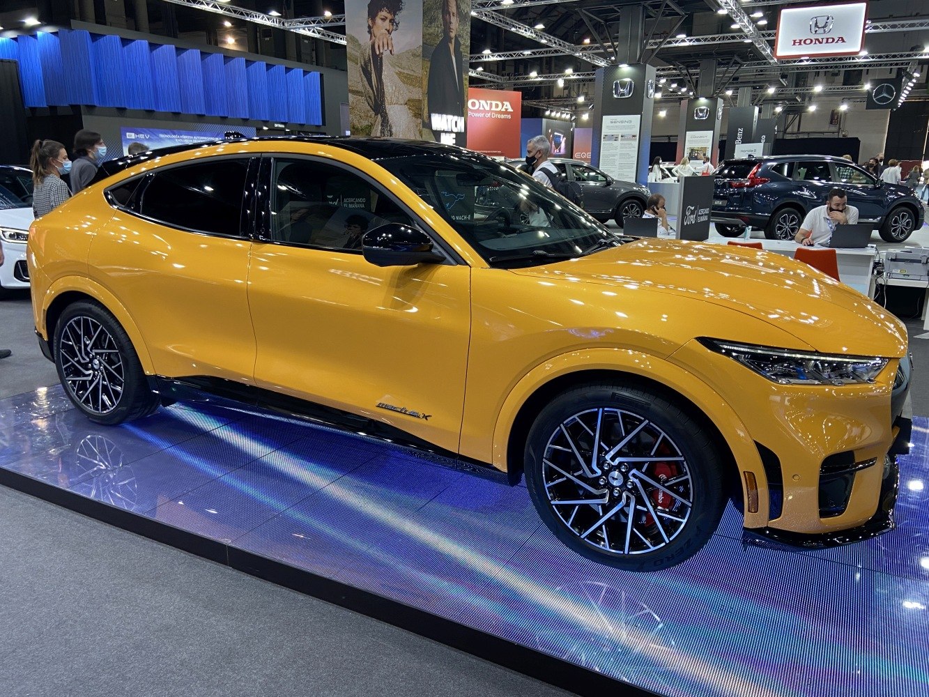 Yellow electric SUV with sleek side profile and modern alloy wheels