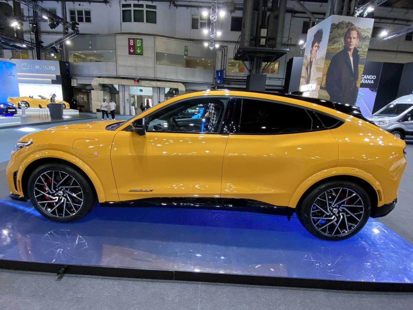 Yellow electric coupe SUV with sporty multi-spoke alloy wheels