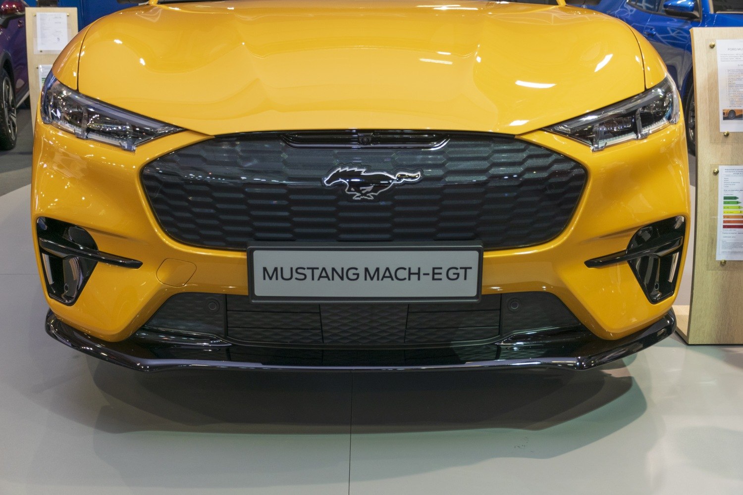 Front grille and LED headlights close-up in yellow Mustang Mach-E