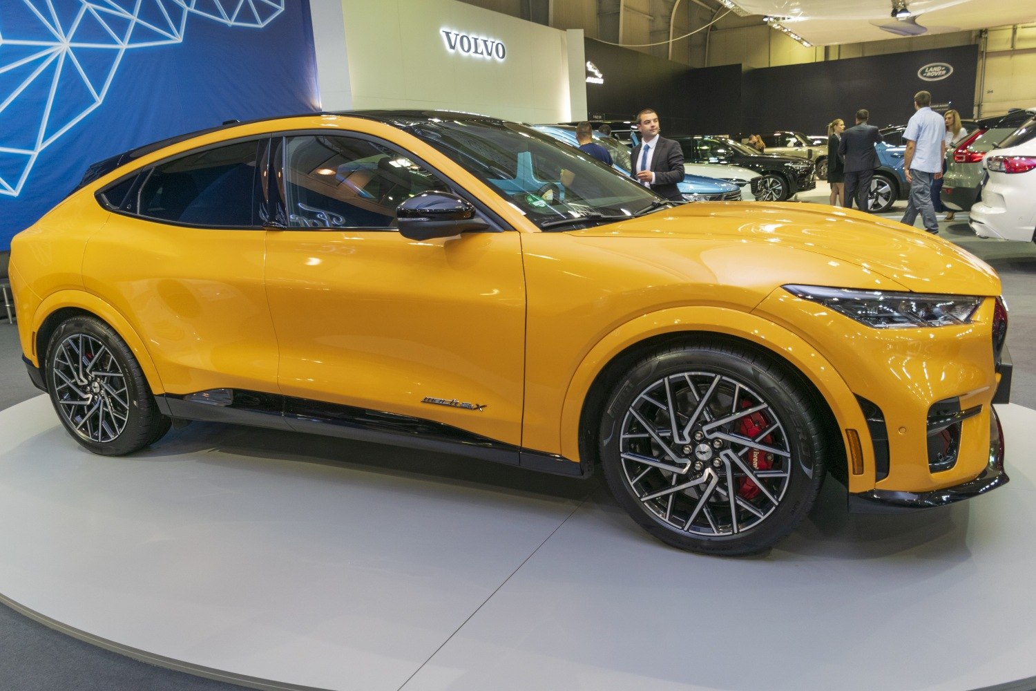 Yellow electric SUV with sporty alloy wheels and sleek LED headlights