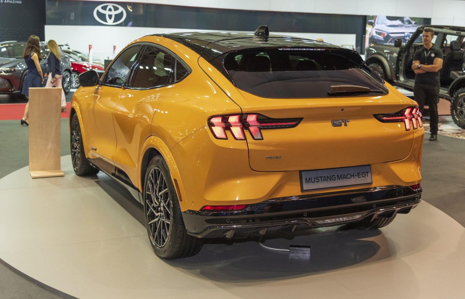 Rear view of a modern electric SUV with signature triple-bar taillights