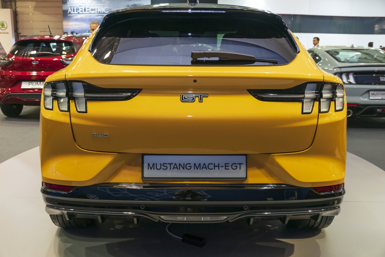 Rear view of electric SUV with distinctive taillights and AWD badge
