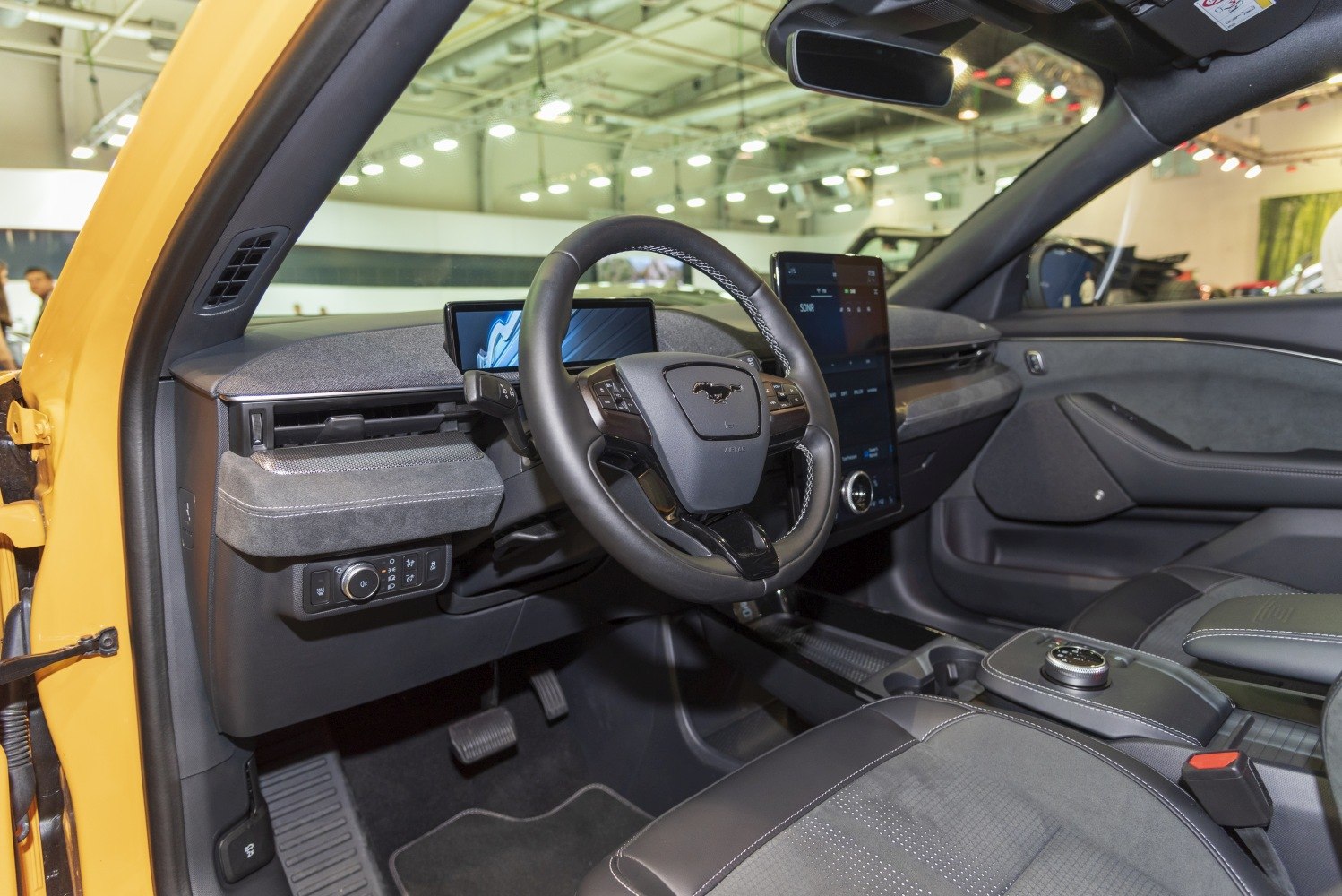 Modern car interior with digital displays and multifunction steering wheel