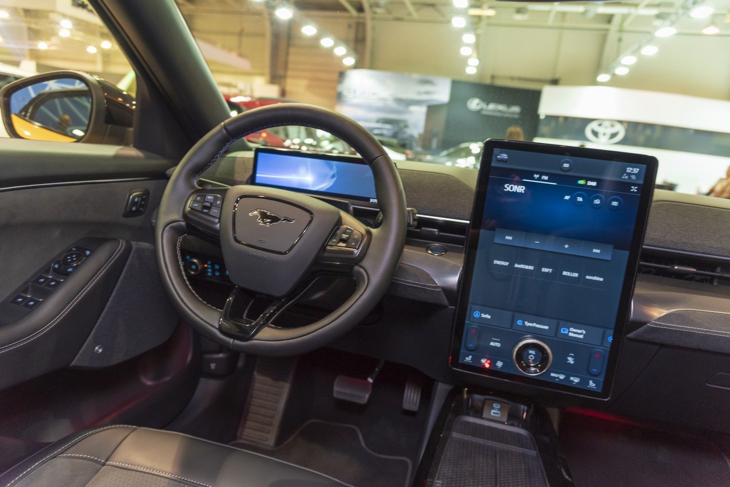 Digital dashboard and large vertical touchscreen in luxury SUV interior