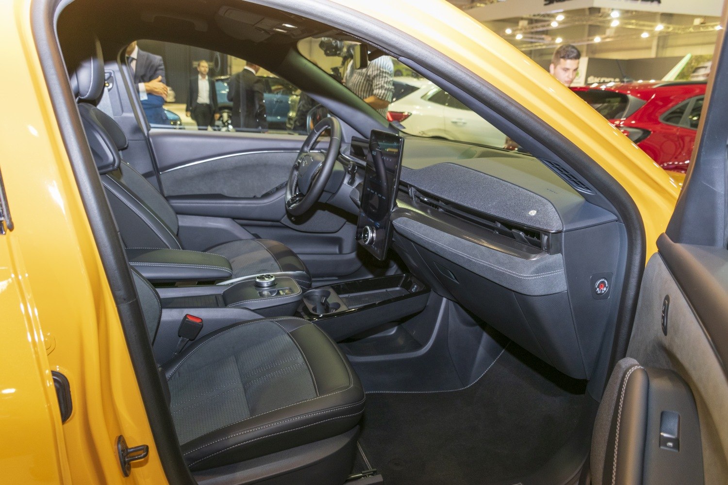 Minimalist interior with vertical touchscreen and black leather seats