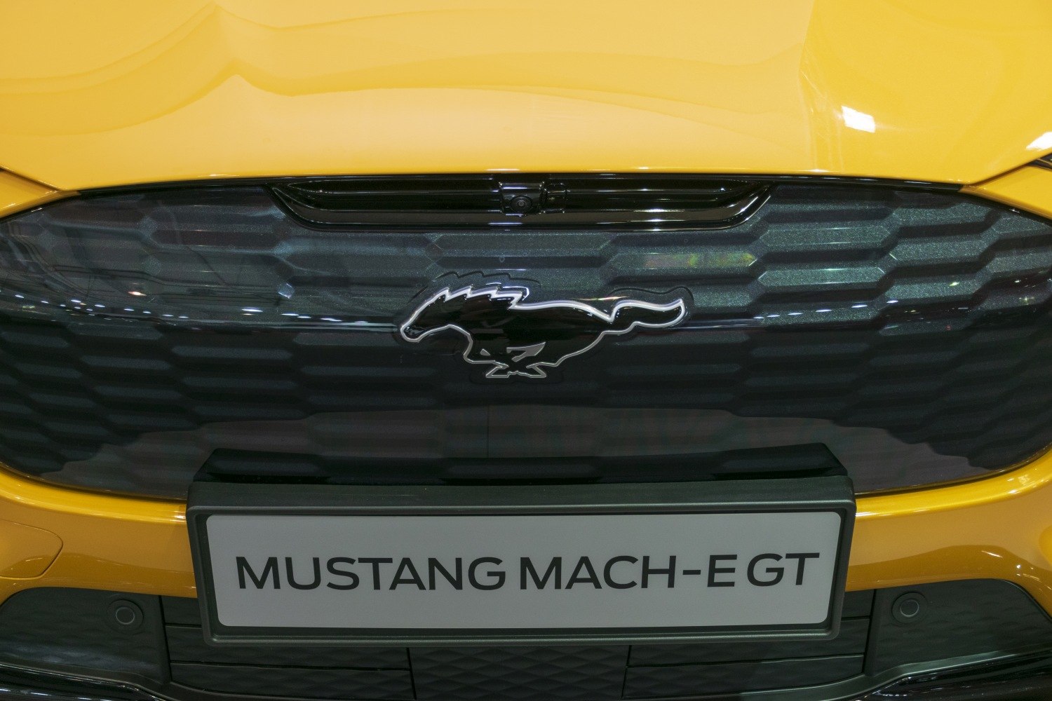 Close-up view of Mustang Mach-E GT front grille and horse emblem