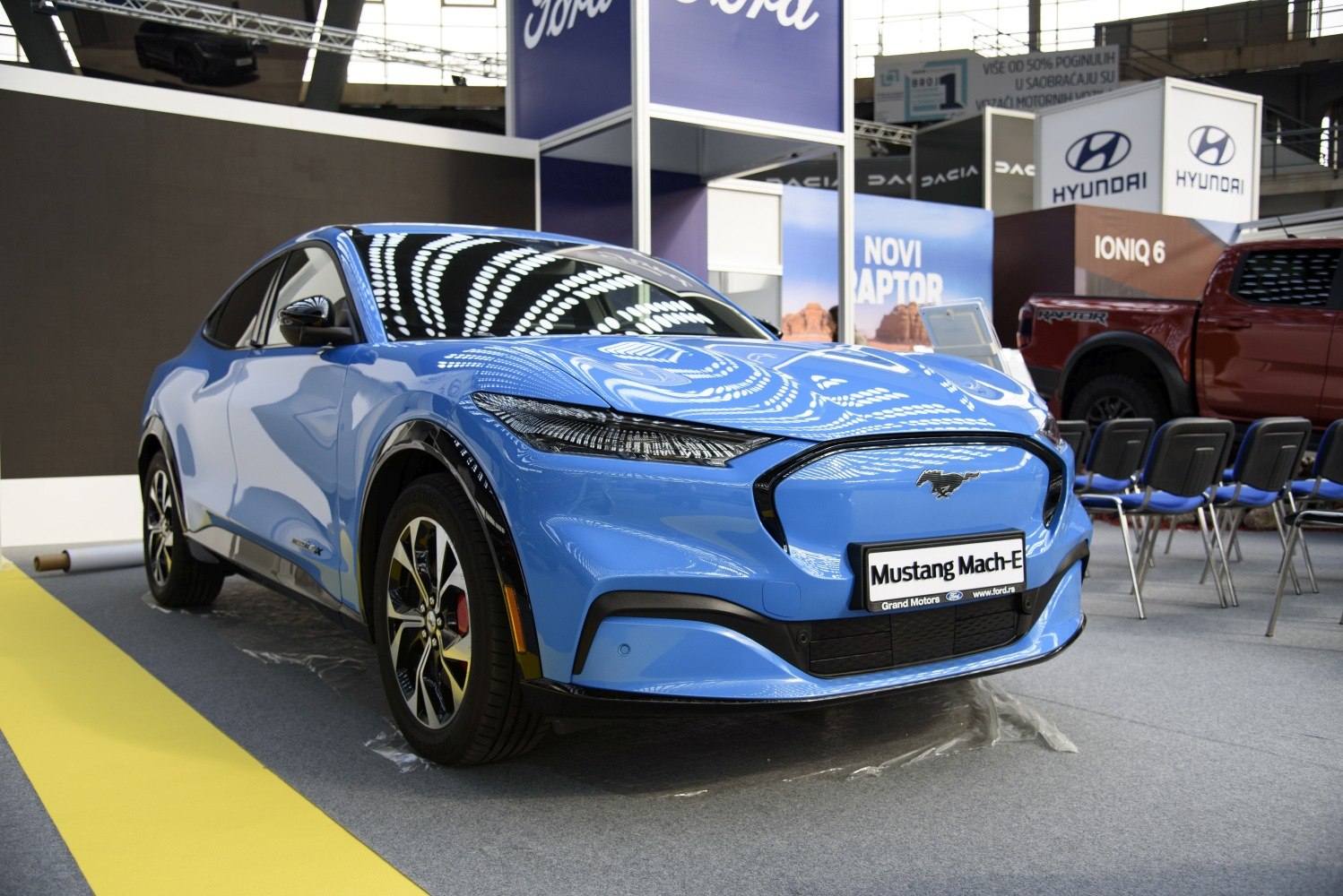 Electric SUV front with sharp headlights and closed grille