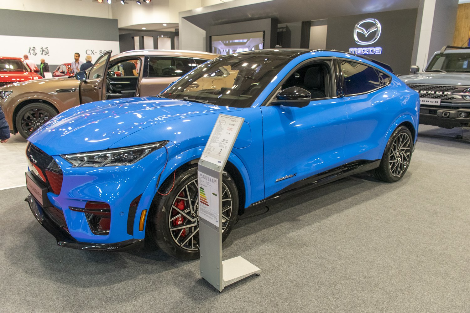Blue electric SUV showcasing sporty alloy wheels and aerodynamic design