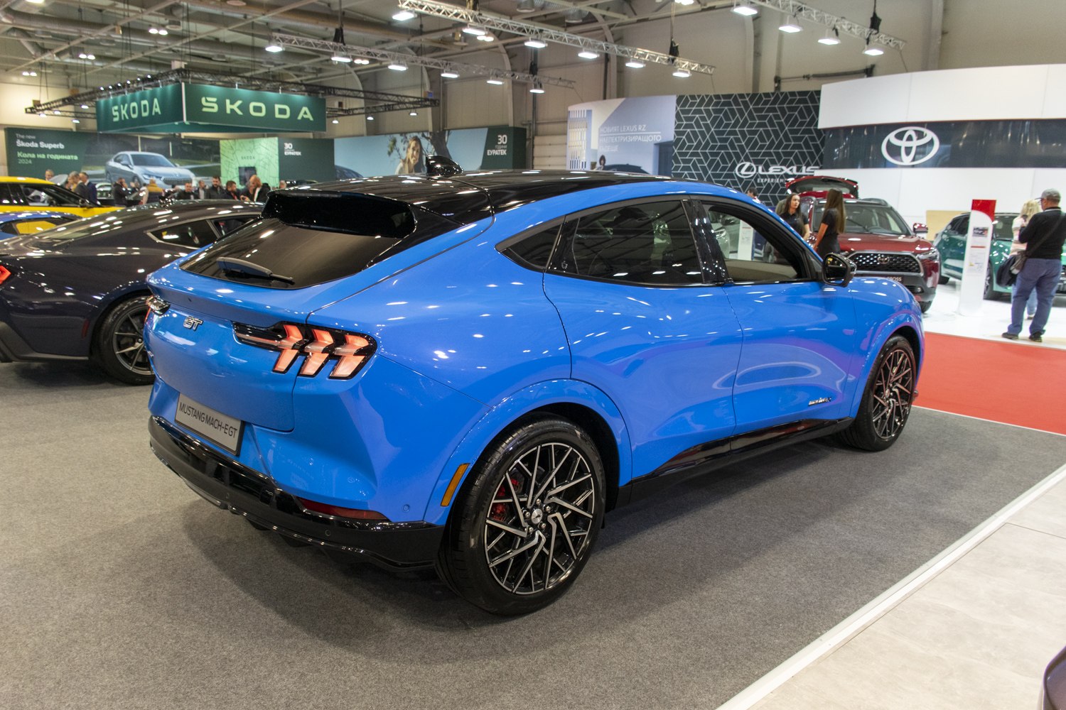 Rear and side view of electric SUV with tri-bar taillights and alloy wheels