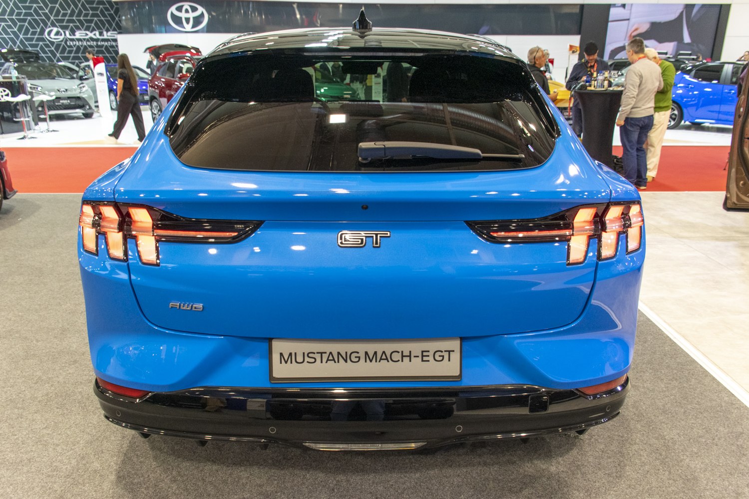 Triple-segment tail lights and distinctive GT badge on a sleek rear design