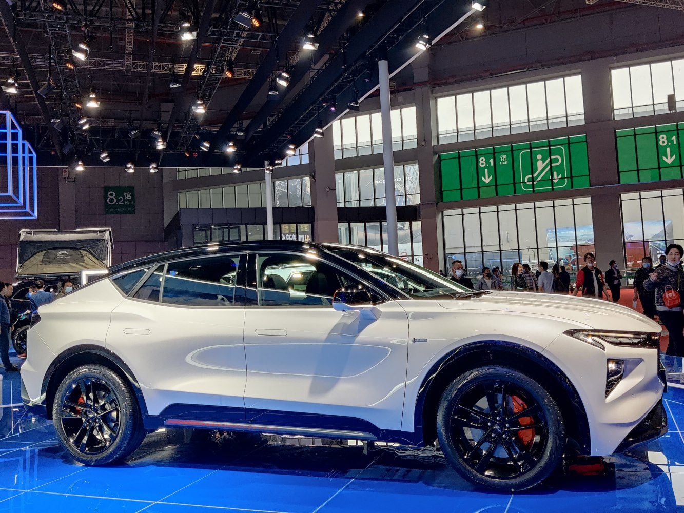Sleek side profile with black wheels and sporty rims