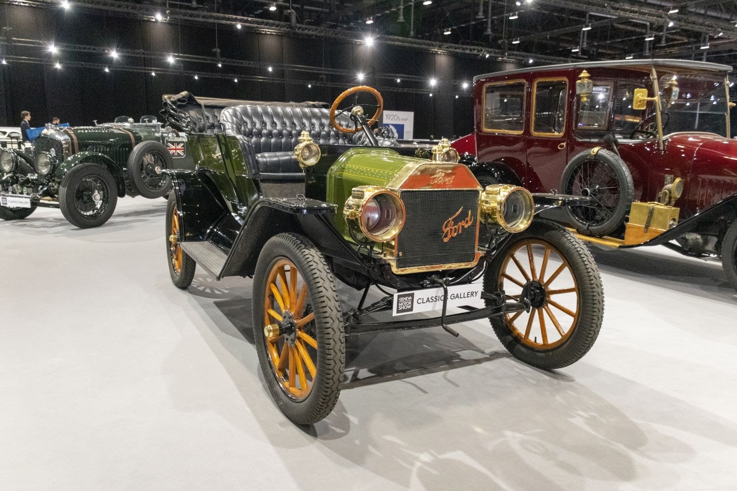 Vintage open-top car with brass fittings and wooden spoke wheels