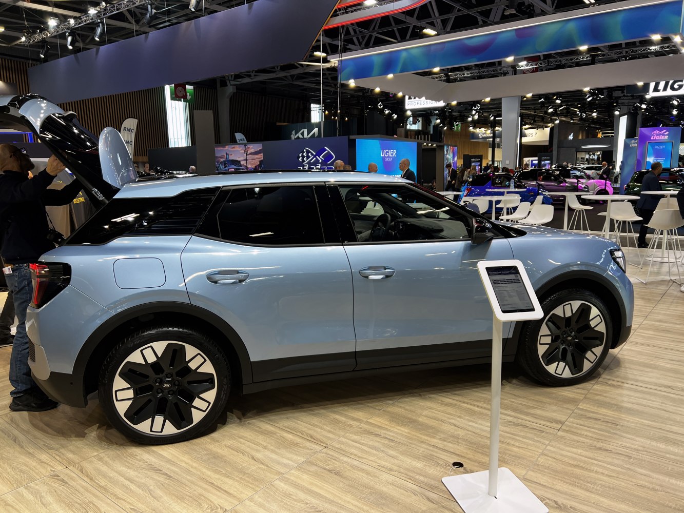 Electric SUV with futuristic wheels and sleek aerodynamic side profile