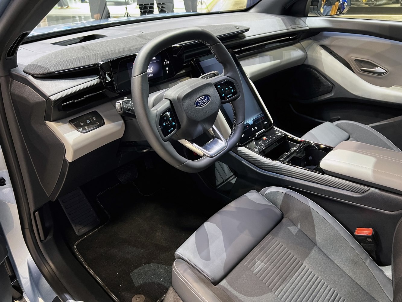 Modern EV interior with digital dashboard and touchscreen controls