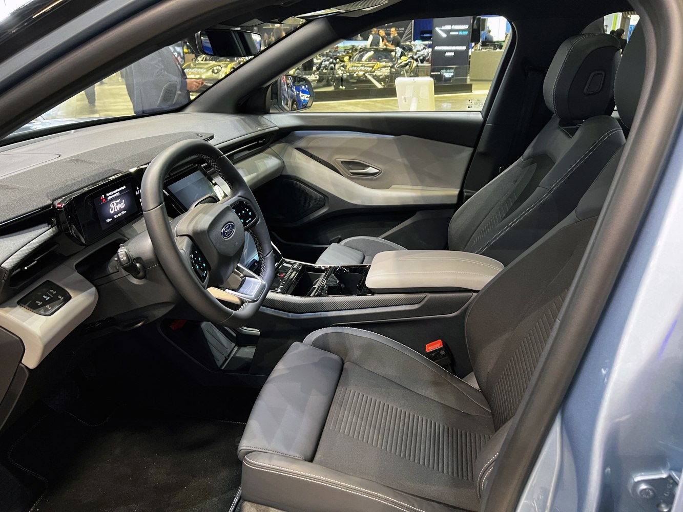 Modern electric SUV interior with digital displays and ergonomic seats