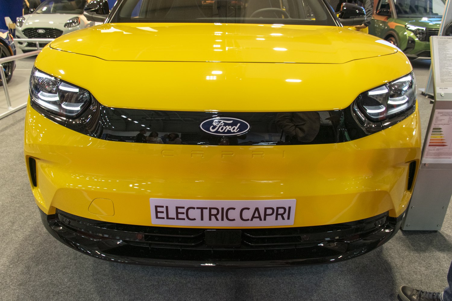 Modern front fascia with LED headlights on yellow electric vehicle