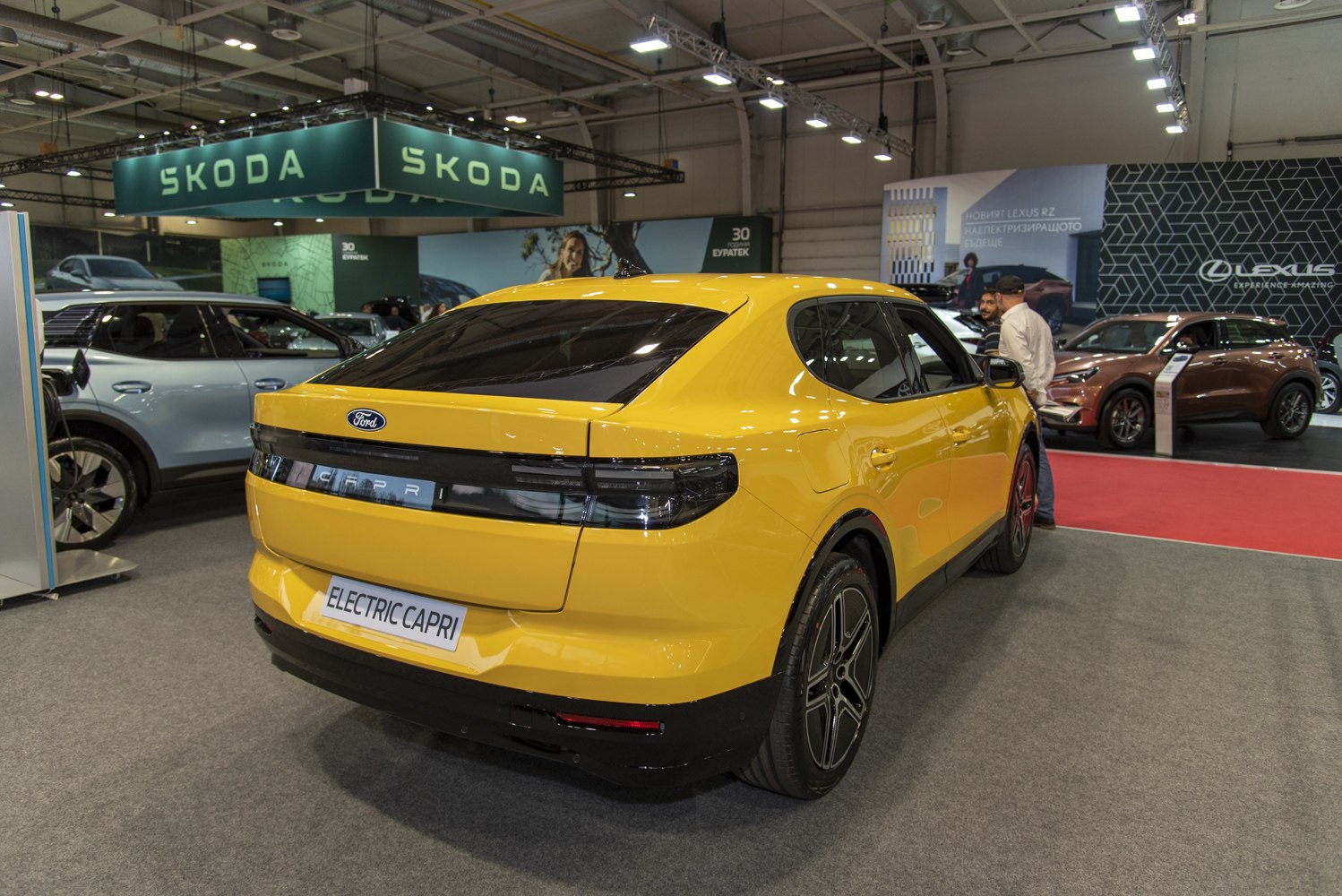 Yellow electric SUV rear view with sleek taillight design