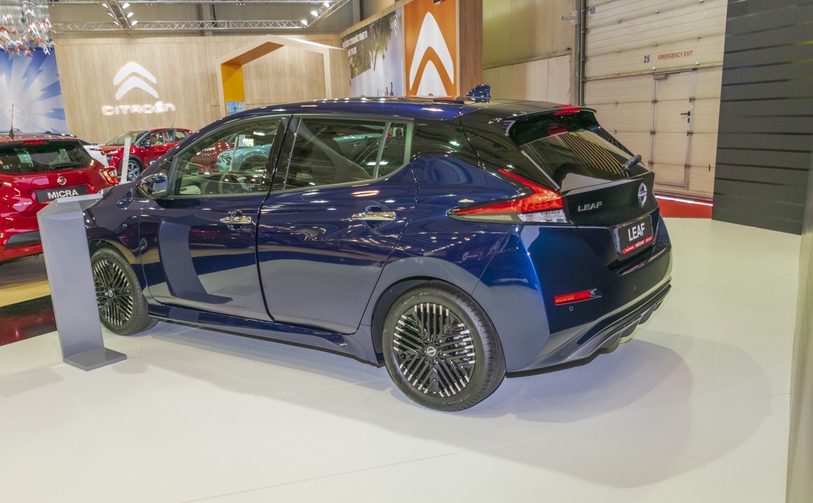 Rear and side profile of an electric hatchback with distinctive wheels
