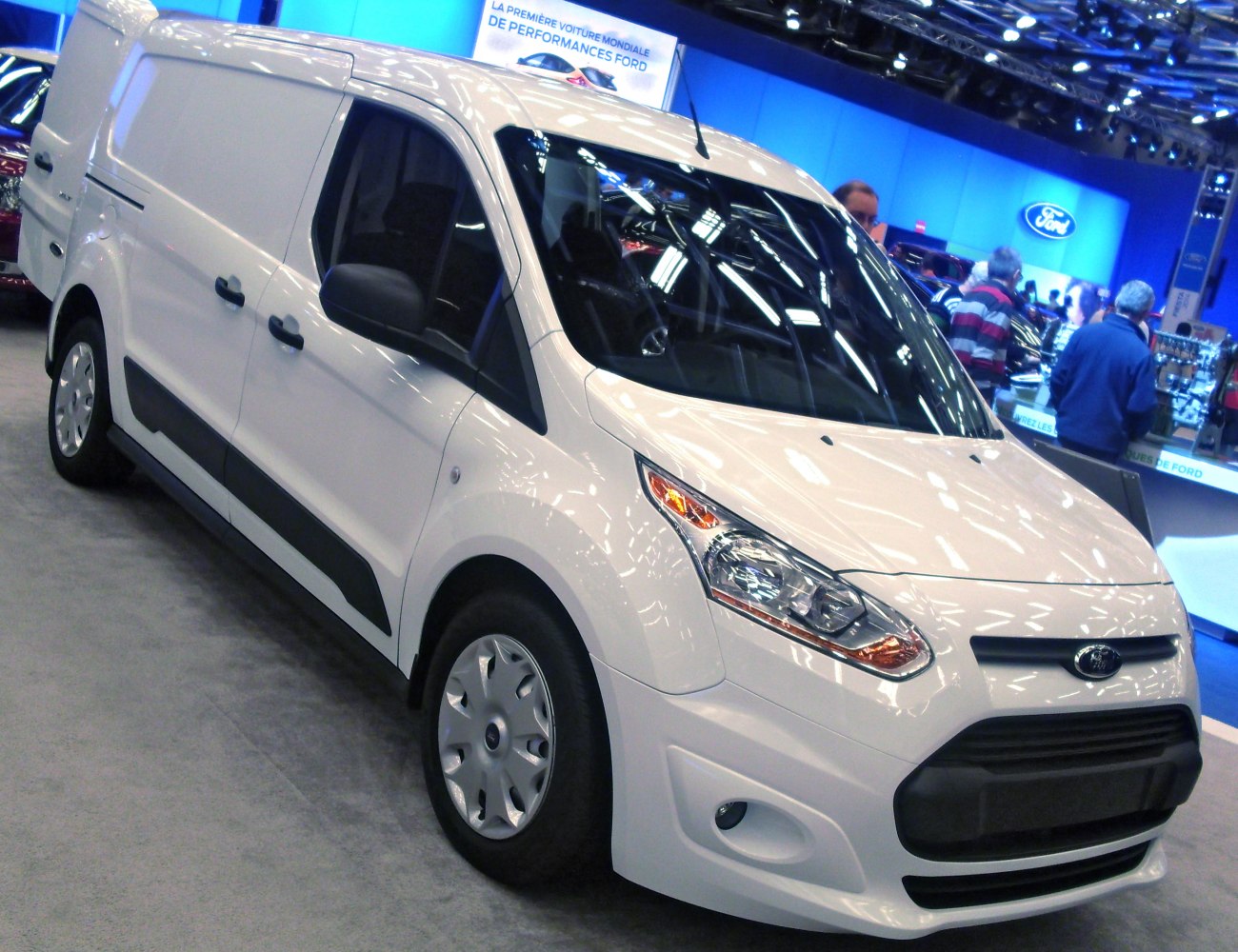 White compact panel van with sliding side door and prominent front end