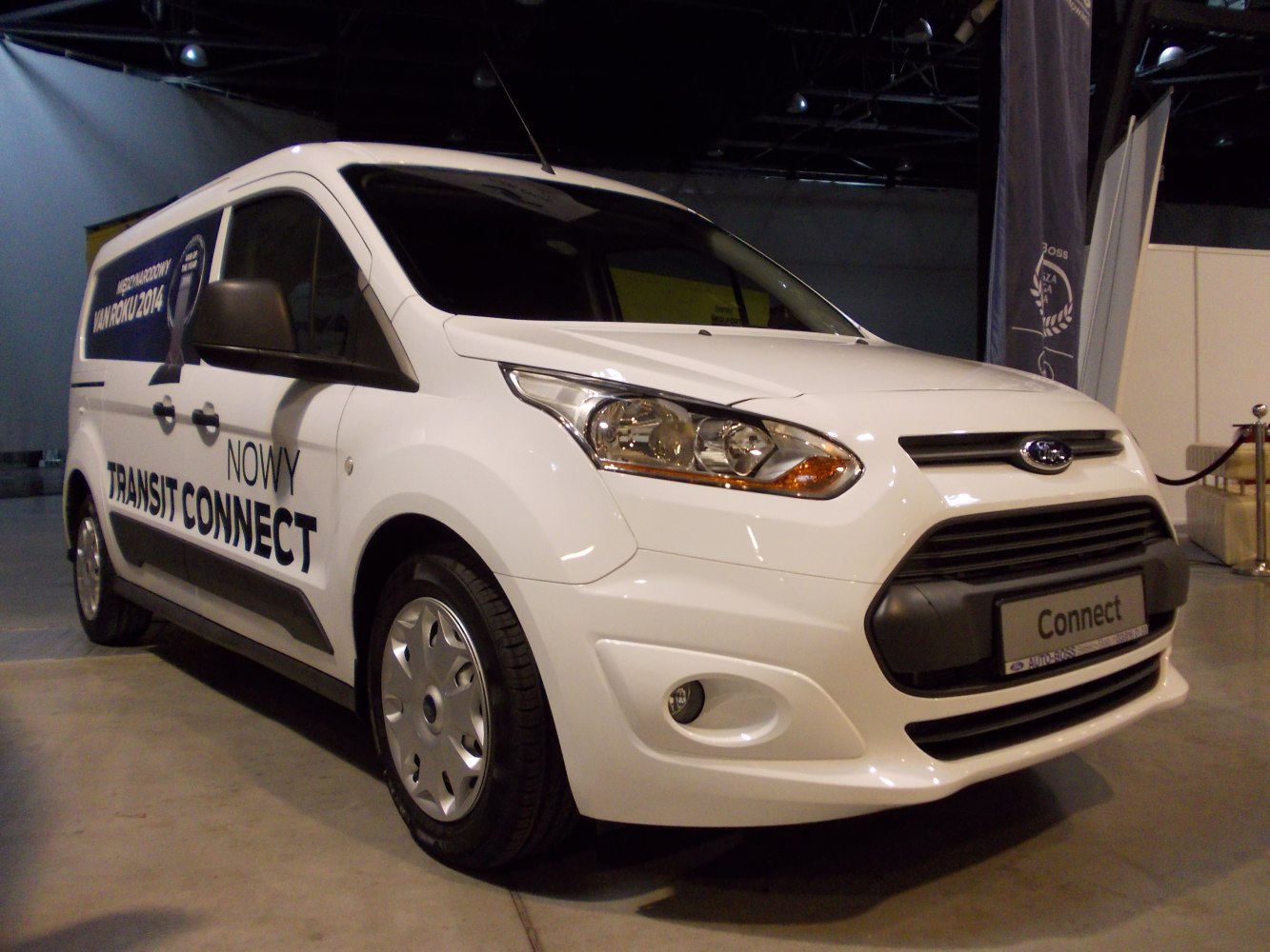 White panel van front view with headlights and black grille