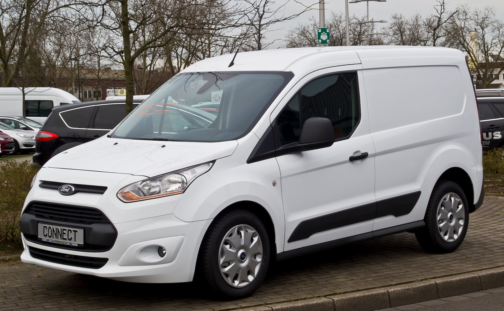 White panel van with modern headlights and compact cargo design