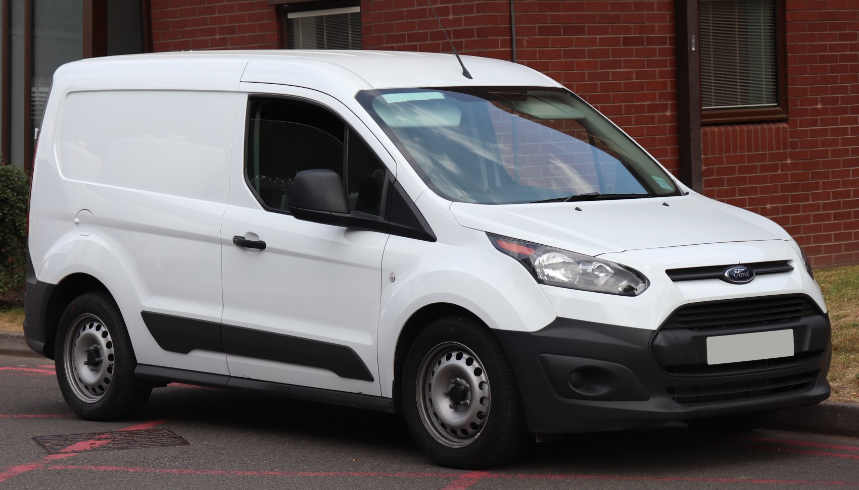 White panel van with black plastic bumpers and steel rims
