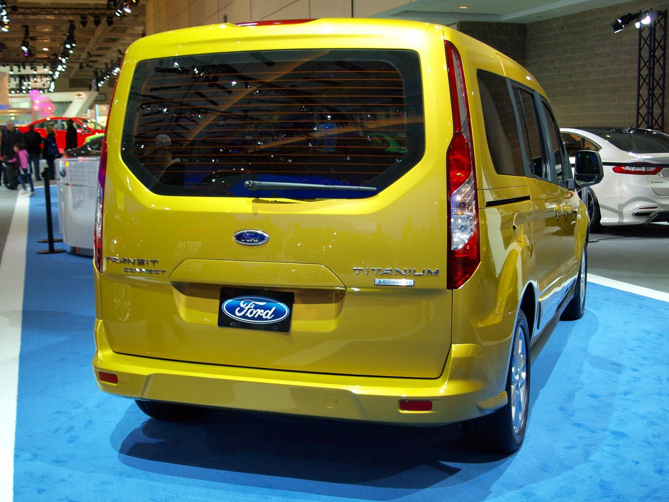 Rear view of van with large back window and vertical tail lights