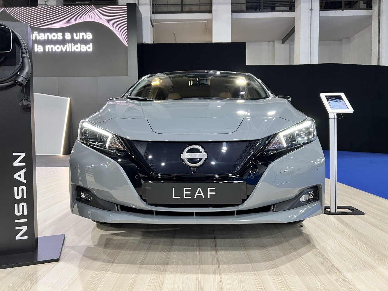 Front view of modern electric vehicle with LED headlights and sleek design