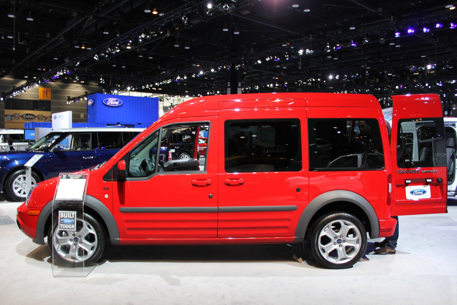Red crew van side view with open rear door