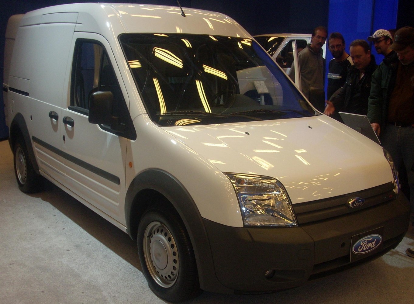 Front and side view of white panel van L2H2 with black trim and steel wheels
