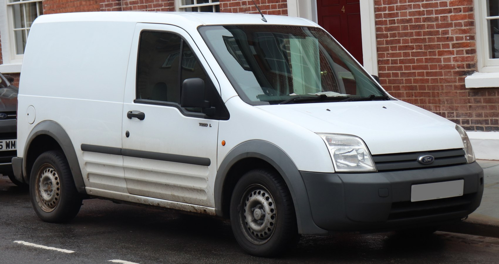 White panel van with plastic bumpers and steel wheels