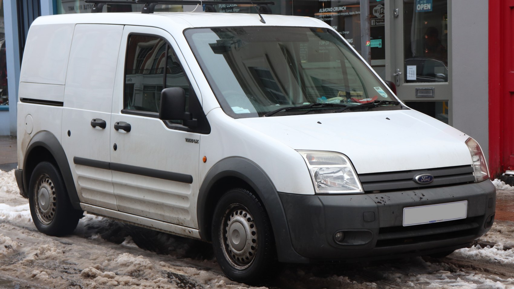White panel van with black trim and steel wheels