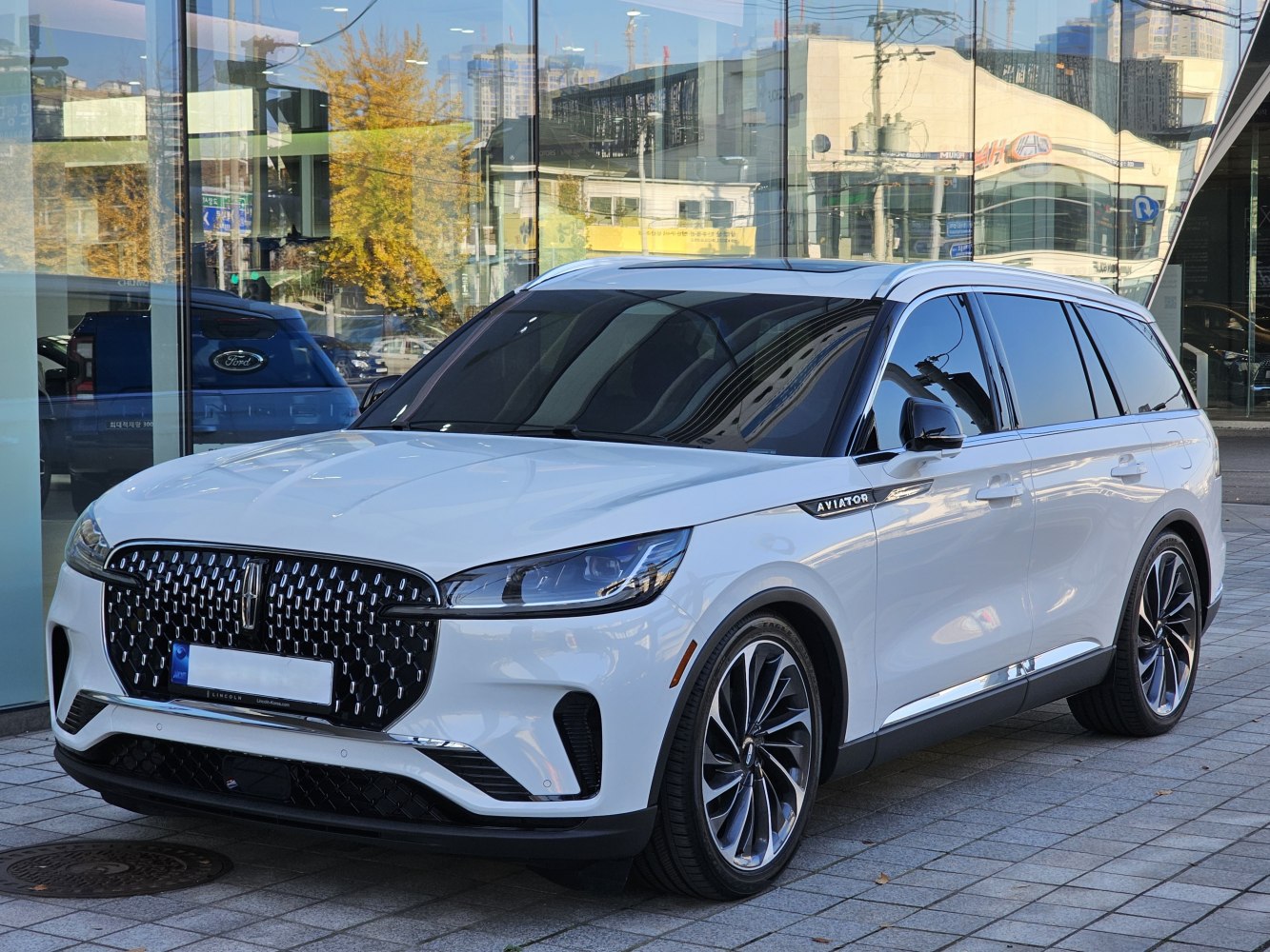 Modern luxury SUV front with distinctive grille and sleek aerodynamic design