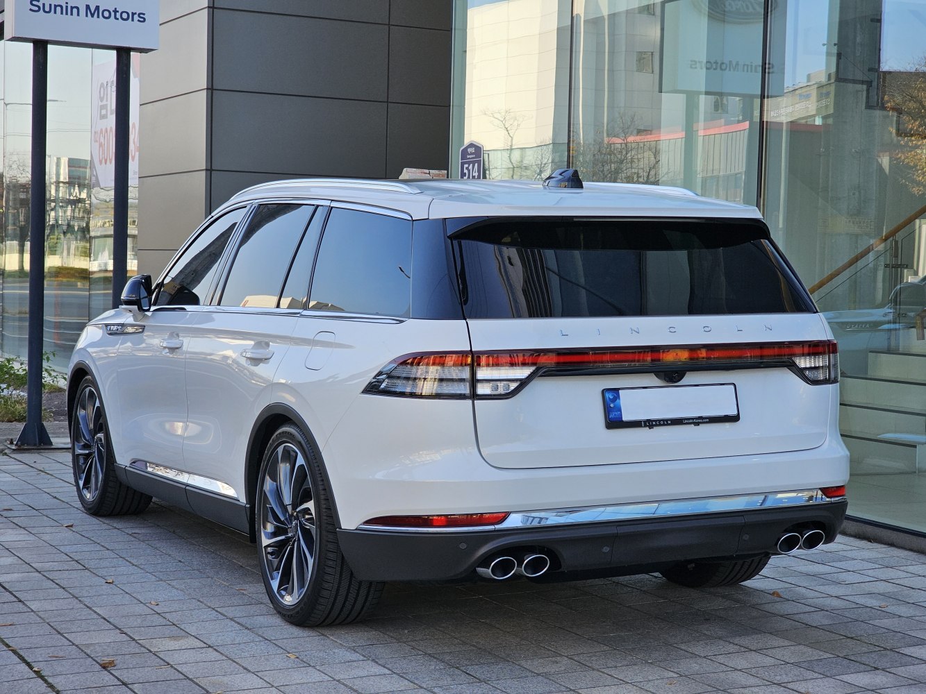 Rear view with quad exhaust pipes and LED tail lights
