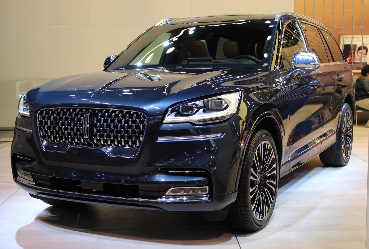 SUV front grille with LED headlights and luxury wheels