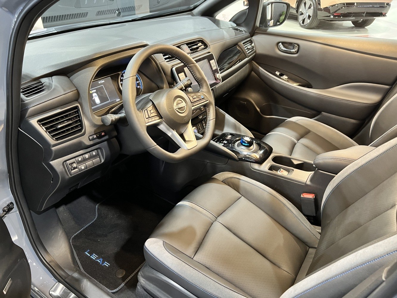 Modern steering wheel and central console with digital dashboard