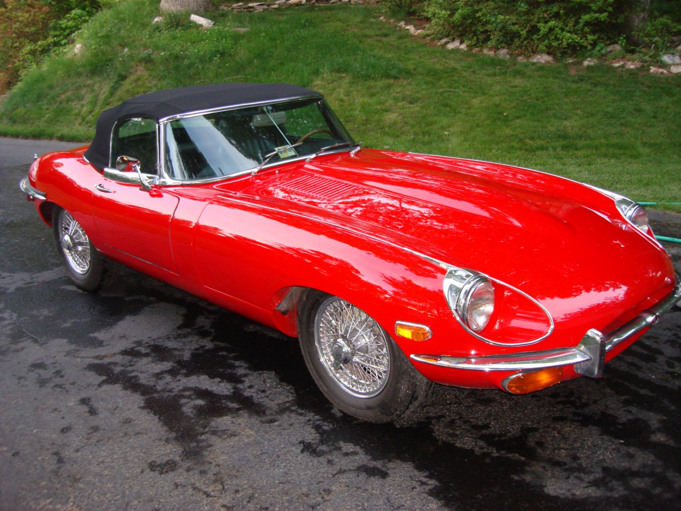 Vintage convertible with wire-spoke wheels and chrome bumpers