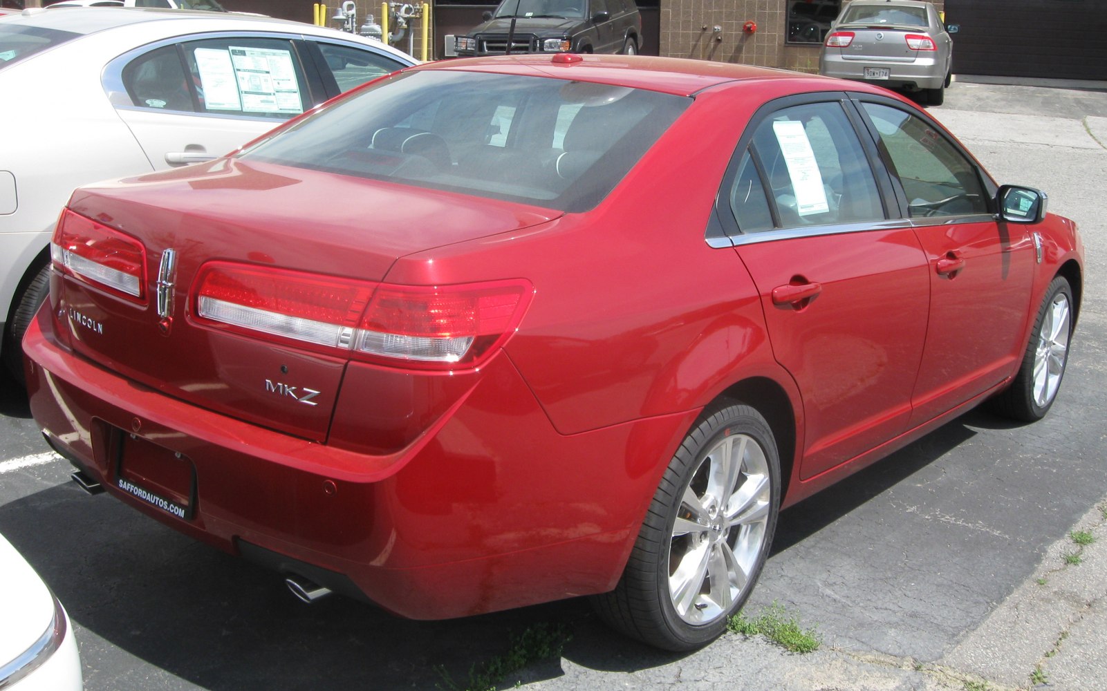 Red luxury sedan rear and side view details