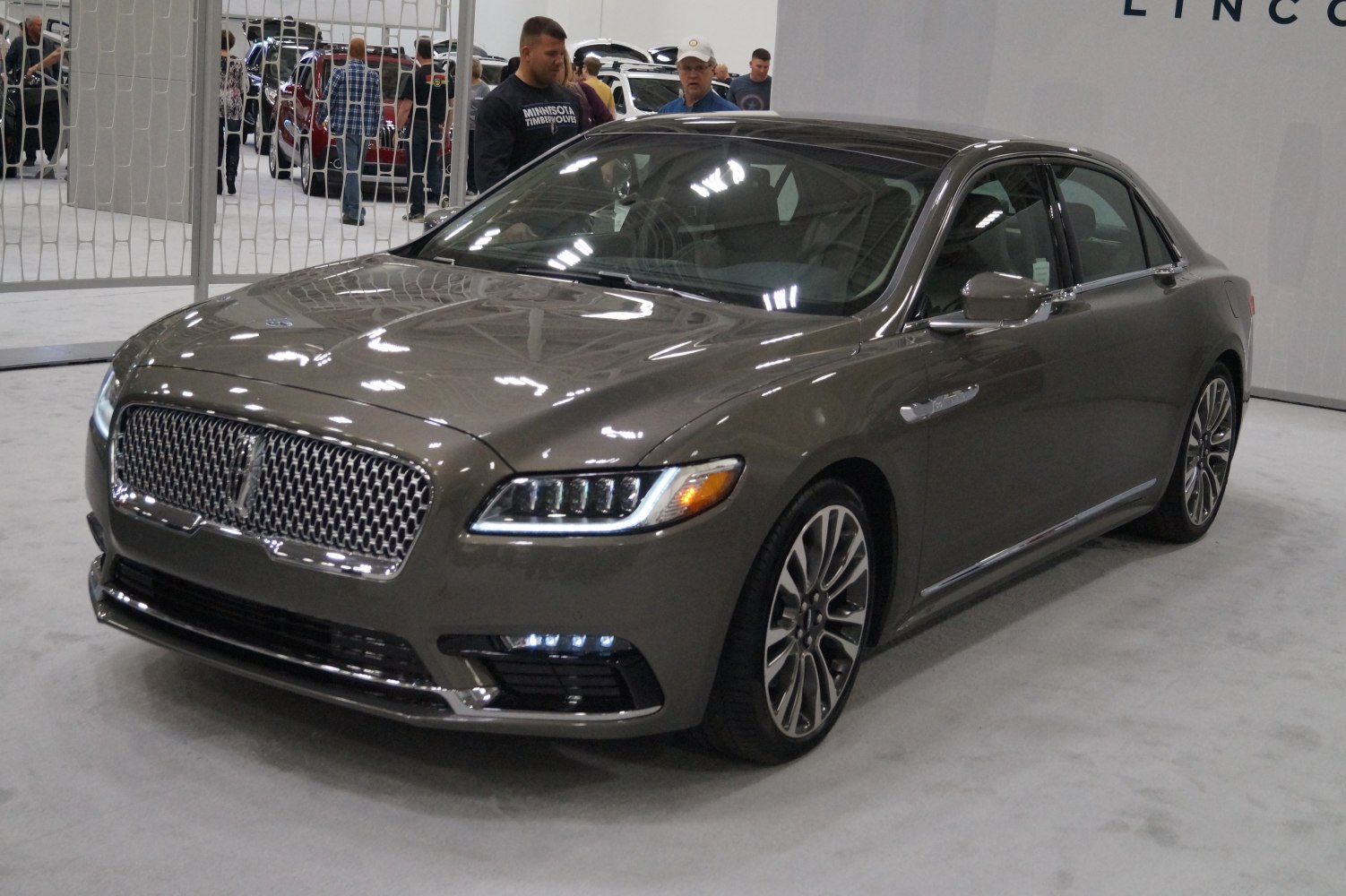 Luxury sedan with prominent front grille and LED headlights