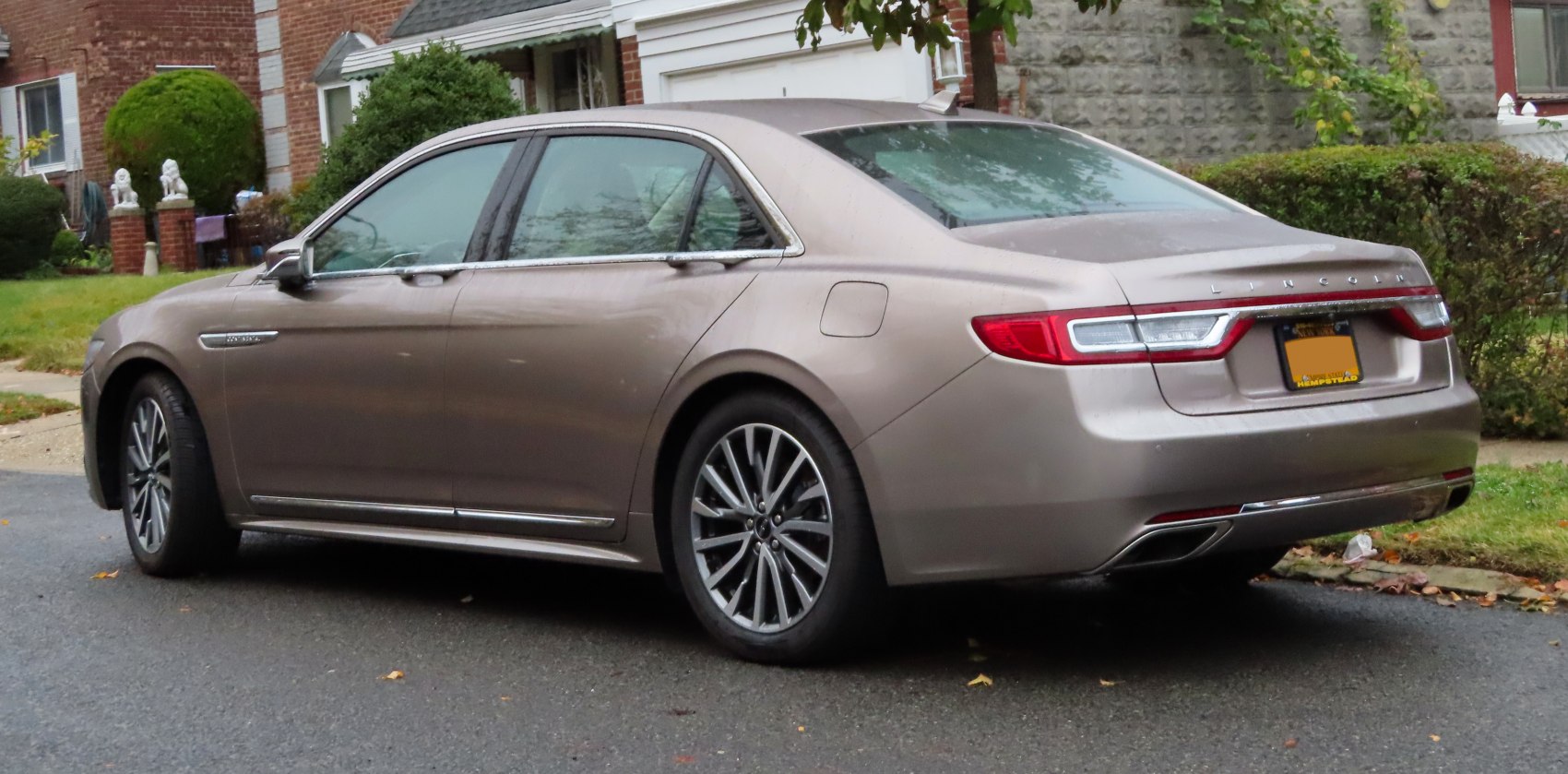 Rear side profile with alloy wheels and connected stylish taillights