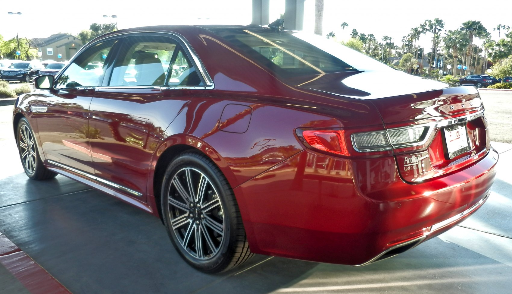 Rear and side view of luxury sedan with alloy wheels