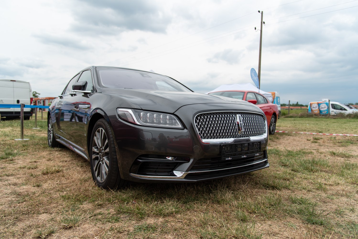 Luxury sedan front with signature grille and LED headlights