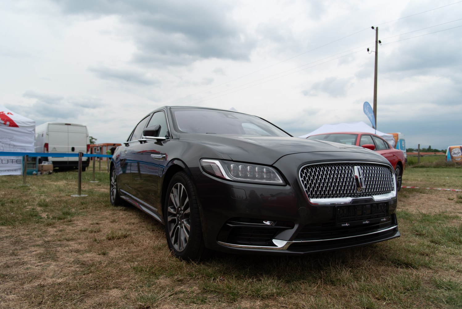 Luxury sedan with LED headlights and chrome mesh grille