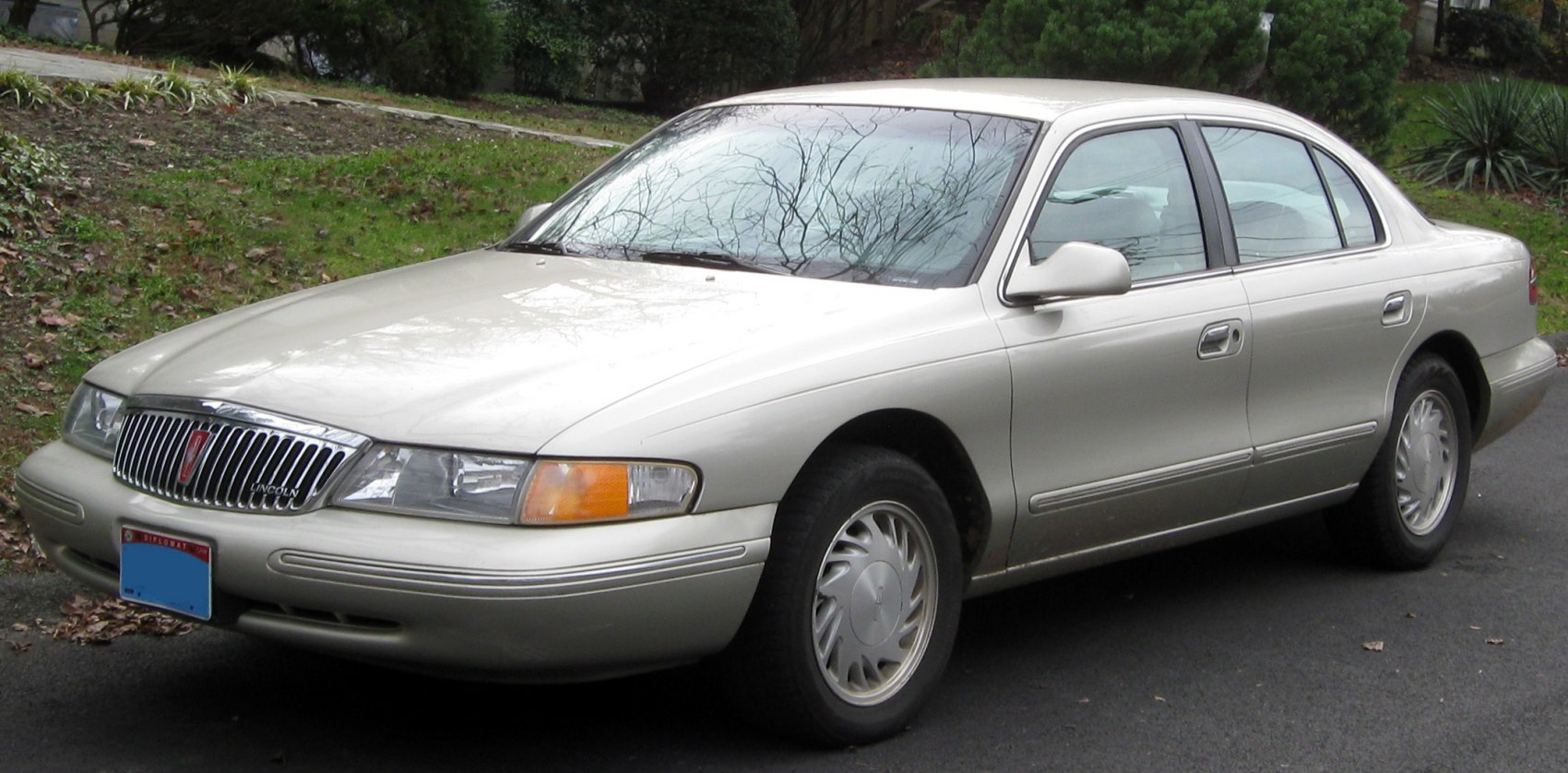 Classic sedan with chrome vertical grille and rectangular headlights