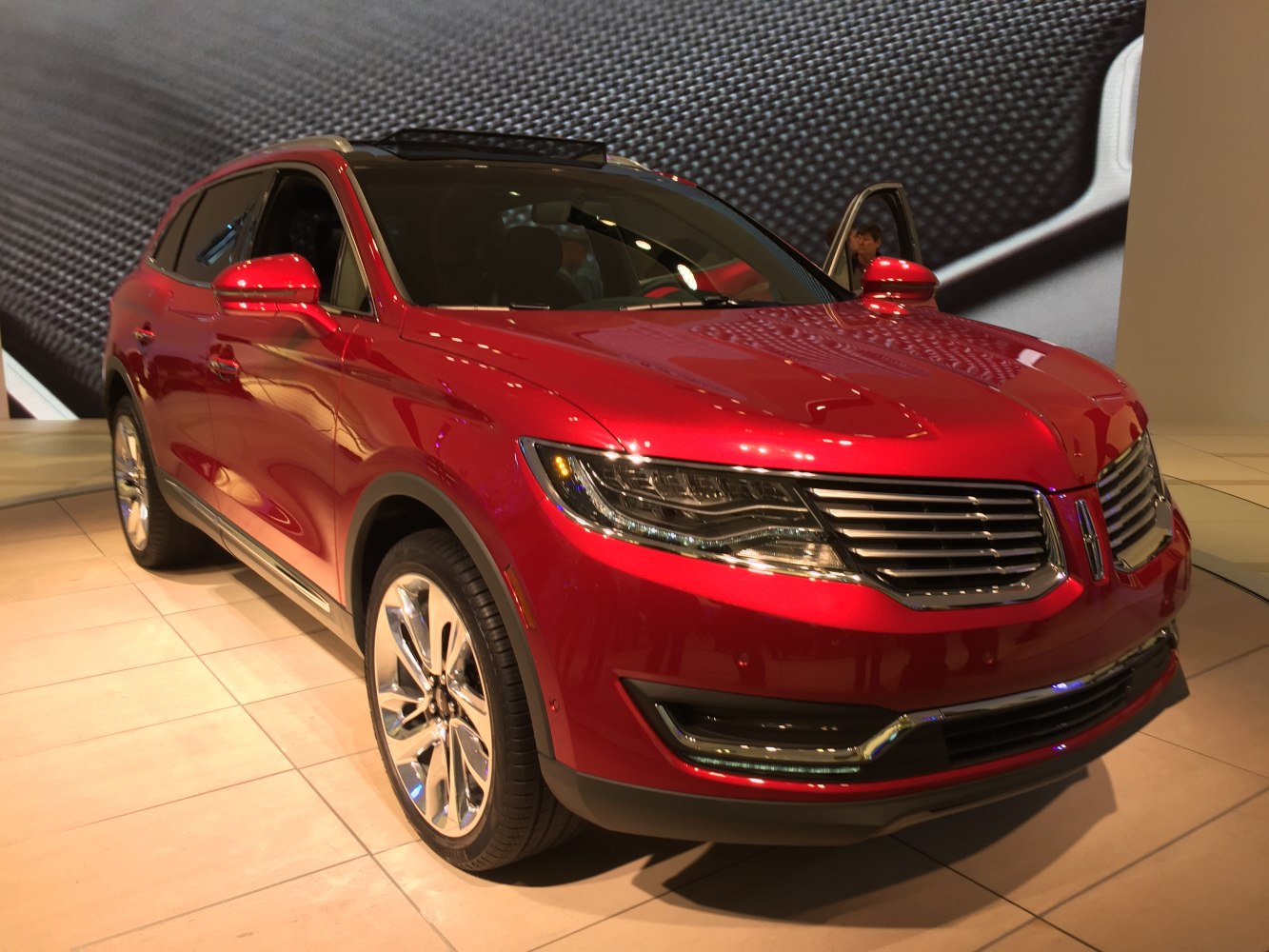 Luxury mid-size SUV with chrome grille and LED headlights