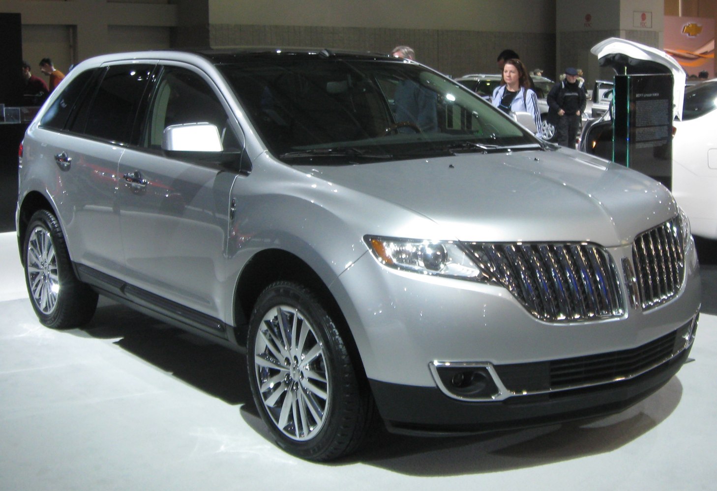 Silver SUV with distinctive grille and alloy wheels, front three-quarter view