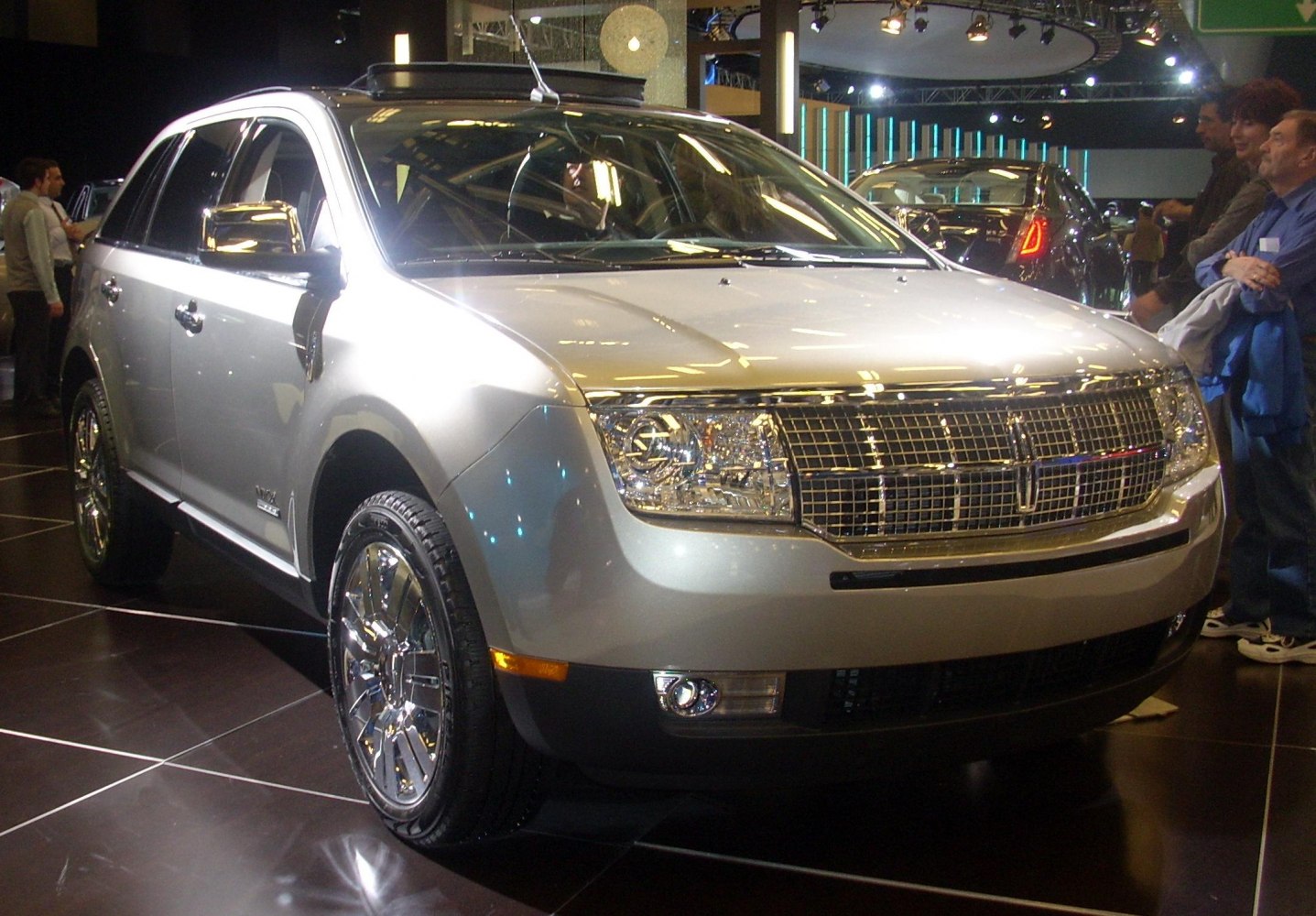 Front view with chrome grille and alloy wheels