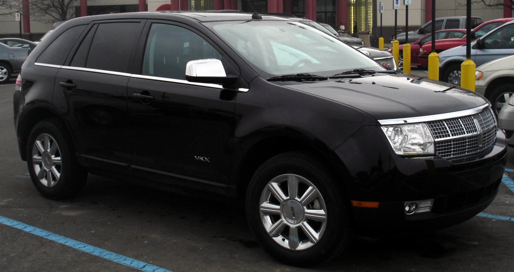 Mid-size SUV front-side view with distinctive grille and chrome mirrors